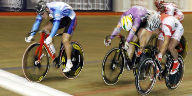 MANCHESTER, United Kingdom: Japan's Kazuya Narita (L) wins heat 4 of the Mens keirin race from Poland's Pawel Kosciecha (R) at the UCI World Cup Classics cycling event at the Manchester Velodrome, north-west England, 23 February 2007. AFP PHOTO/ANDREW YATES (Photo credit should read ANDREW YATES/AFP/Getty Images)