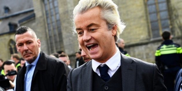 Dutch far-right politician Geert Wilders of the PVV party reacts as a dog barks at him as he campaigns in Valkenburg, Netherlands, March 11, 2017. REUTERS/Dylan Martinez