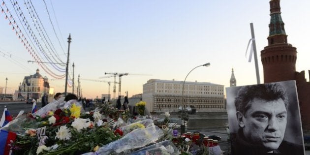 MOSCOW, RUSSIA - MARCH 10: People continue to place flowers at the bridge, where Boris Nemtsov killed and next to Kremlin, all day long on March 10, 2015 in Moscow, Russia. Russian opposition leader Boris Nemtsov was shot dead in central Moscow on 27th of February 2015. (Photo by Sefa Karacan/Anadolu Agency/Getty Images)