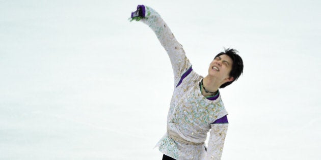 Yuzuru Hanyu of Japan reacts after his performance during the men's singles free skating at the ISU Grand...