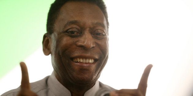 RIO DE JANEIRO, BRAZIL - MAY 15: Brazilian soccer legend Pele speaks to customers in the Apple store on May 15, 2014 in Rio de Janeiro, Brazil. Pele and film director Anibal Neto spoke with customers about 'Pele Eterno', a documentary about Pele's life. The 2014 FIFA World Cup kicks off on June 12. (Photo by Mario Tama/Getty Images)