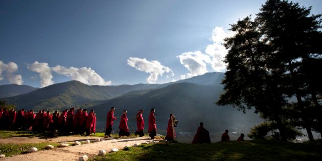 Bhutanese novice Buddhist monks walk to breakfast at a monastery in the capital of Thimphu, Bhutan, Wednesday, Oct. 12, 2011. King Jigme Khesar Namgyal Wangchuck and future Queen Jetsun Pema will wed in the small Himalayan Kingdom in a series ceremonies set for Thursday.(AP Photo/Kevin Frayer)