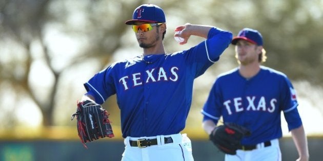 SURPRISE, AZ - MARCH 08: Yu Darvish #11 of the Texas Rangers works out during the spring training at the Surprise Stadium on March 8, 2015 in Surprise, Arizona. (Photo by Masterpress/Getty Images)