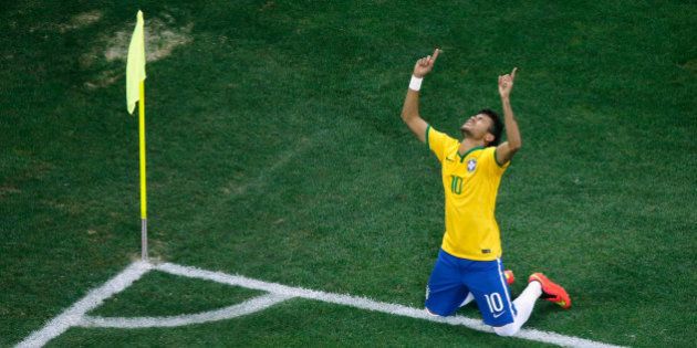 SAO PAULO, BRAZIL - JUNE 12: Neymar of Brazil celebrates scoring his second goal on a penalty kick in the second half during the 2014 FIFA World Cup Brazil Group A match between Brazil and Croatia at Arena de Sao Paulo on June 12, 2014 in Sao Paulo, Brazil. (Photo by Fabrizio Bensch - Pool/Getty Images)