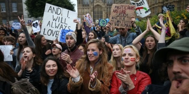 Demonstrators chant and clap on College Green outside The Houses of Parliament at an anti-Brexit protest in central London on June 28, 2016.EU leaders attempted to rescue the European project and Prime Minister David Cameron sought to calm fears over Britain's vote to leave the bloc as ratings agencies downgraded the country. Britain has been pitched into uncertainty by the June 23 referendum result, with Cameron announcing his resignation, the economy facing a string of shocks and Scotland making a fresh threat to break away. / AFP / JUSTIN TALLIS (Photo credit should read JUSTIN TALLIS/AFP/Getty Images)