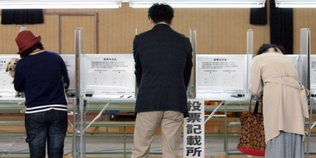 Voters fill in ballot papers at a polling station in Osaka on May 17, 2015 to vote on a referendum to reform the city administration into a metropolitan government. The people of Osaka started voting on a plan to streamline Japan's second city in the mould of global metropolises like London, New York and Tokyo, as the one-time commercial capital seeks to recapture its glory days. JAPAN OUT -- AFP PHOTO / JIJI PRESS (Photo credit should read JIJI PRESS/AFP/Getty Images)