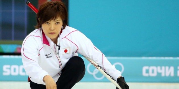 SOCHI, RUSSIA - FEBRUARY 14: Ayumi Ogasawara of Japan delivers the stone during the Curling Women's Round Robin match between Japan and Great Britain on day seven of the Sochi 2014 Winter Olympics at Ice Cube Curling Center on February 14, 2014 in Sochi, Russia. (Photo by Robert Cianflone/Getty Images)