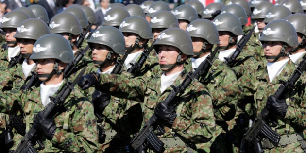 FILE - In this Oct. 27, 2013 file photo, members of Japan Self-Defense Forces march during the Self-Defense Forces Day at Asaka Base, north of Tokyo. Several Asian nations are arming up, their wary eyes fixed squarely on one country: a resurgent China thatâs boldly asserting its territorial claims all along the East Asian coast. The scramble to spend more defense dollars comes amid spats with China over contested reefs and waters. Other Asian countries such as India and South Korea are quickly modernizing their forces, although their disputes with China have stayed largely at the diplomatic level. (AP Photo/Shizuo Kambayashi, File)