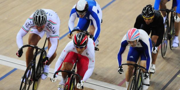 (Foreground L-R) Track cyclists Roberto Chiappa of Italy, Kiyofumi Naga of Japan and Edgar Ross of Great Britain compete in the 2008 Beijing Olympic Games men's keirin first round at the Laoshan Velodrome in Beijing on August 16, 2008. AFP PHOTO / MARTIN BERNETTI (Photo credit should read MARTIN BERNETTI/AFP/Getty Images)