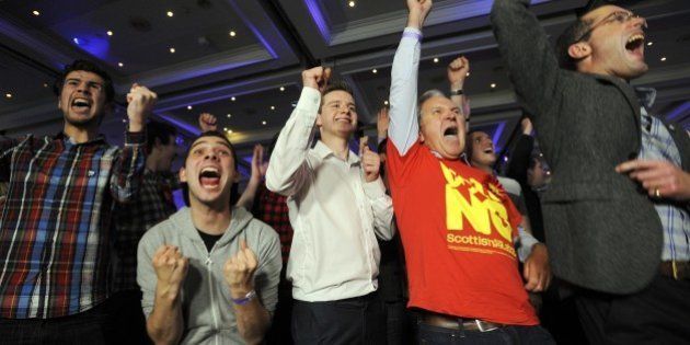 Pro-union supporters react as Scottish independence referendum results come in at a Better Together event in Glasgow on September 19, 2014. The question for voters at Scotland's more than 5,000 polling stations is 'Should Scotland be an independent country?' and they are asked to mark either 'Yes' or 'No'. The result is expected in the early hours of Friday. AFP PHOTO/ANDY BUCHANAN (Photo credit should read Andy Buchanan/AFP/Getty Images)