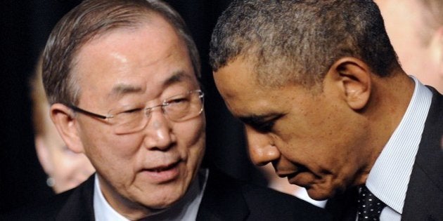 UN secretary general Ban Ki-moon chats with US President Barack Obama (R) after posing for a family picture with other world leaders, ministers and heads of international organisations on the second day of the two-day Nuclear Security Summit (NSS) in The Hague on March 25, 2014. The world must construct a system to fight nuclear terror with the world's atomic watchdog playing a central role, a draft of the Nuclear Security Summit's final statement says. AFP PHOTO/POOL/JOHN THYS (Photo credit should read JOHN THYS/AFP/Getty Images)