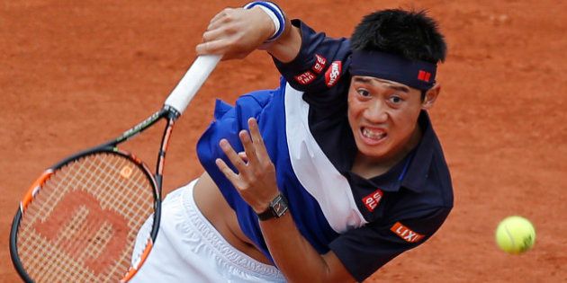 Japan's Kei Nishikori serves in the fourth round match of the French Open tennis tournament against Russia's Teymuraz Gabashvili at the Roland Garros stadium, in Paris, France, Sunday, May 31, 2015. (AP Photo/Michel Euler)