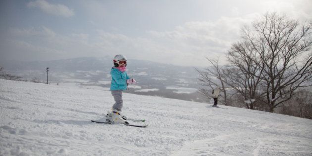 Japanese Child skiing in Niseko, Hokkaido, Japan.