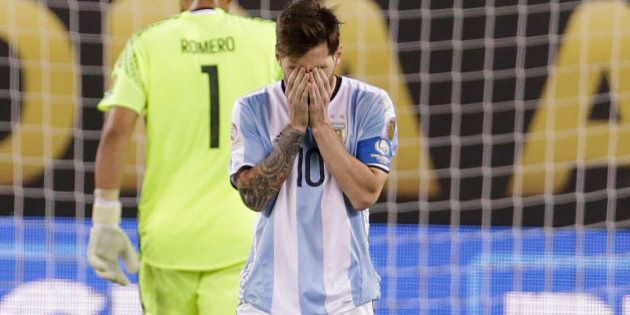 Jun 26, 2016; East Rutherford, NJ, USA; Argentina midfielder Lionel Messi (10) after missing penalty kick against Chile in the championship match of the 2016 Copa America Centenario soccer tournament at MetLife Stadium. Mandatory Credit: Adam Hunger-USA TODAY Sports