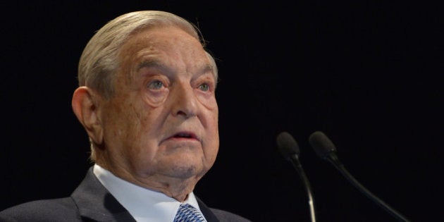 NEW YORK, NY - NOVEMBER 06: Honoree George Soros speaks onstage at the Annual Freedom Award Benefit hosted by the International Rescue Committee at the Waldorf-Astoria hotel on November 6, 2013 in New York City. (Photo by Mike Coppola/Getty Images for International Rescue Committee)