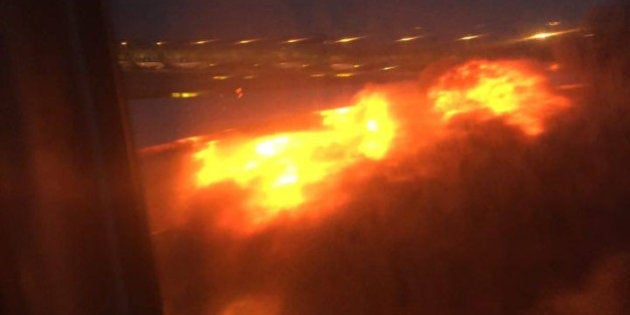 This image provided by Lee Bee Yee shows an engine on fire on a Singapore Airlines flight on Monday,...