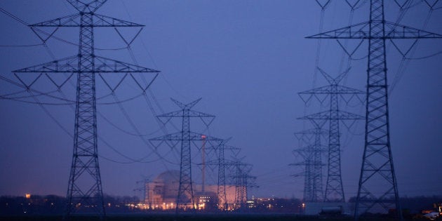 STADLAND, GERMANY - MARCH 21: Electricity pylons stand in a row leading to the Unterweser nuclear power plant on March 21, 2011 near Stadland, Germany. The Unterweser plant is among seven nuclear power reactors built before 1980 that the government of German Chancellor Angela Merkel has chosen to shut down for three months for a heightened safety and security review following the disaster at the Fukushima plant in Japan. Merkel is fending off criticism for the move, which represents a radical reversal of her government's previous policy, citing new circumstances due to the Fukushima meltdown. Nuclear power has long been a highly charged, controversial topic in Germany and opponents are seizing on the new political climate to push for a rapid abandonment of nuclear energy. (Photo by Sean Gallup/Getty Images)