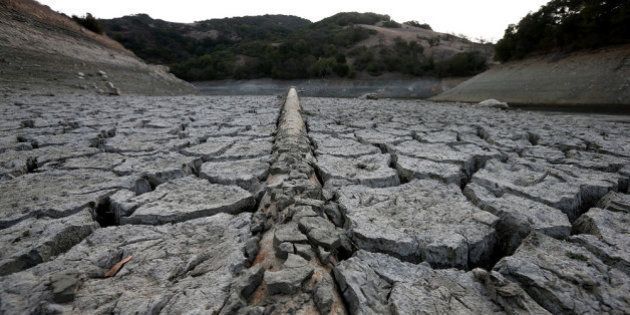 SAN JOSE, CA - JANUARY 28: A pipe emerges from dried and cracked earth that used to be the bottom of the Almaden Reservoir on January 28, 2014 in San Jose, California. Now in its third straight year of drought conditions, California is experiencing its driest year on record, dating back 119 years, and reservoirs throughout the state have low water levels. Santa Clara County reservoirs are at 3 percent of capacity or lower. California Gov. Jerry Brown officially declared a drought emergency to speed up assistance to local governments, streamline water transfers and potentially ease environmental protection requirements for dam releases. (Photo by Justin Sullivan/Getty Images)