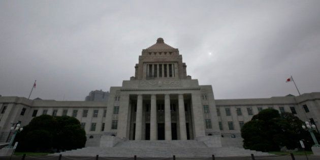 The Diet building stands at dusk in Tokyo Tuesday, July 13, 2010. The Democrats' ruling coalition enjoys a comfortable majority in the powerful lower house, but it lost control of the upper house of parliament in the July 11 elections. If past experience holds, the