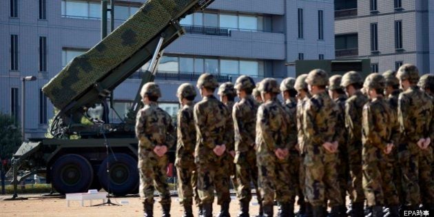 Japanese military personel stand in front of Patriot Advanced Capability (PAC-3) surface-to-air missile units before an inspection by Prime Minister Yoshihiko Noda at the Defense Ministry in Tokyo, Japan, 07 December 2012. Japan is deploying PAC-3 missile launcher across the country after North Korea announced it will launch a rocket carrying a satellite between 10 and 22 December. EPA/FRANCK ROBICHON