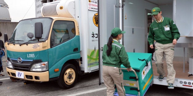 Japan's auto giant Toyota Motor and its subsidiary Hino Motors display the new electric trucks, a one-ton capacity and equipped with compartments to keep cool and frozen, in Tokyo on march 1, 2013. The EV truck, including its refrigator and freezer, is powered by Li-ion batteries, meaning it generates no emission during operation. Japan's delivery company Yamato Transport will start trial using of two EV trucks from middle of this month. AFP PHOTO / Yoshikazu TSUNO (Photo credit should read YOSHIKAZU TSUNO/AFP/Getty Images)