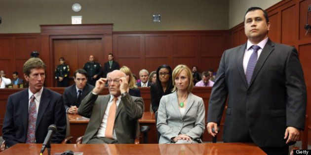 SANFORD, FL - JULY 13: George Zimmerman (R) stands as the jury arrives to deliver the verdict, on the 25th day of his trial at the Seminole County Criminal Justice Center July 13, 2013 in Sanford, Florida. Zimmerman was found not guilty of second-degree murder in the 2012 shooting death of Trayvon Martin. (Photo by Joe Burbank-Pool/Getty Images)