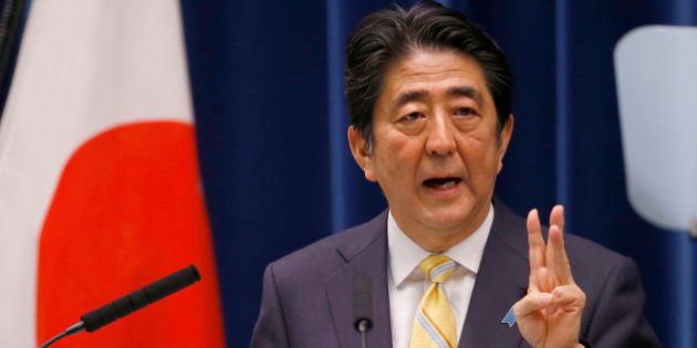 Japan's Prime Minister Shinzo Abe speaks during a press conference at his official residence in Tokyo, Thursday, May 14, 2015. Japan's Cabinet endorsed a set of defense bills Thursday that would allow the country's military to go beyond its self-defense stance and play a greater role internationally, a plan that has split public opinion. (AP Photo/Shizuo Kambayashi)