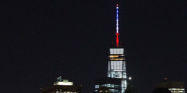 NEW YORK, NY - NOVEMBER 13: One World Trade Center's spire is shown lit in French flags colors of white, blue and red in solidarity with France after tonight's terror attacks in Paris, November 13, 2015 in New York City. According to reports, over 150 people were killed in a series of bombings and shootings across Paris, including at a soccer game at the Stade de France and a concert at the Bataclan theater. (Photo by Daniel Pierce Wright/Getty Images)