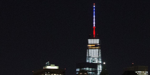 NEW YORK, NY - NOVEMBER 13: One World Trade Center's spire is shown lit in French flags colors of white, blue and red in solidarity with France after tonight's terror attacks in Paris, November 13, 2015 in New York City. According to reports, over 150 people were killed in a series of bombings and shootings across Paris, including at a soccer game at the Stade de France and a concert at the Bataclan theater. (Photo by Daniel Pierce Wright/Getty Images)