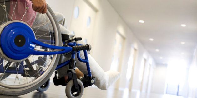 Man with broken leg in a wheelchair