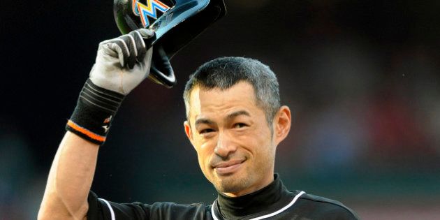 Miami Marlins' Ichiro Suzuki (51) tips his hat to the fans after his single against the St. Louis Cardinals in the first inning of a baseball game, Saturday, Aug. 15, 2015, at Busch Stadium in St. Louis. (AP Photo/Bill Boyce)