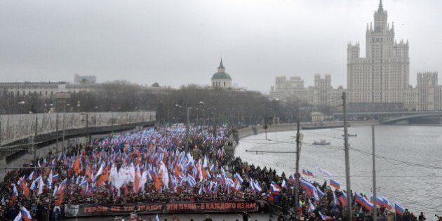 Russia's opposition supporters march in memory of murdered Kremlin critic Boris Nemtsov in central Moscow on March 1, 2015. The 55-year-old former first deputy prime minister under Boris Yeltsin was shot in the back several times just before midnight on February 27 as he walked across a bridge a stone's throw from the Kremlin walls. AFP PHOTO / YURI KADOBNOV (Photo credit should read YURI KADOBNOV/AFP/Getty Images)
