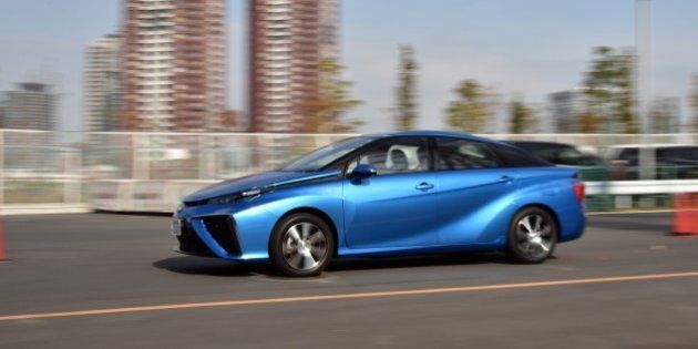 This picture taken on November 17, 2014 shows Japanese auto giant Toyota Motor's fuel cell vehicle 'Mirai', meaning future, cruising in Tokyo. The Mirai, which can drive 650km from a charge of hydrogen, will go on sale in Japan with a price of 62,000 USD (7.2 million yen) on December 15. AFP PHOTO / Yoshikazu TSUNO (Photo credit should read YOSHIKAZU TSUNO/AFP/Getty Images)
