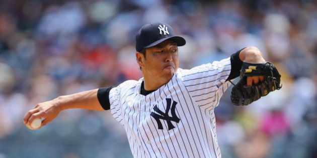 NEW YORK, NY - AUGUST 10: Hiroki Kuroda #18 of the New York Yankees pitches against the Cleveland Indians during their game at Yankee Stadium on August 10, 2014 in the Bronx borough of New York City. (Photo by Al Bello/Getty Images)