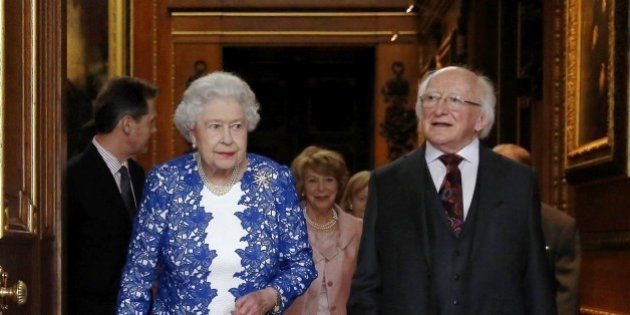 Britain's Queen Elizabeth II and Irish President Michael D Higgins attend a Northern Ireland-themed reception organised as part of the Irish president's state visit to Britain at Windsor Castle in Windsor, west of London, on April 10, 2014. AFP PHOTO / POOL / LUKE MACGREGOR (Photo credit should read LUKE MACGREGOR/AFP/Getty Images)