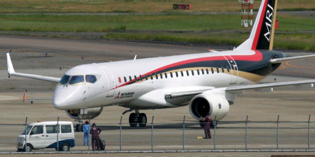 A Mitsubishi Regional Jet (MRJ) passenger aircraft, developed by Mitsubishi Aircraft Corp., taxies during a low speed taxiing test at Prefectural Nagoya Airport in Toyoyama Town, Aichi Prefecture, Japan, on Wednesday, June 10, 2015. Mitsubishi Aircraft, which is developing Japan's first passenger jet, says the company is looking to expand its business in Europe and the Middle East and expects its first orders from there soon. Photographer: Kiyoshi Ota/Bloomberg via Getty Images