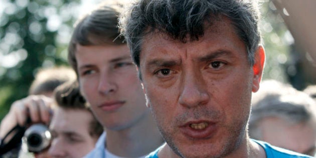 Russian opposition leader Boris Nemtsov speaks to youth opposition protesters, evicted by police from a protest camp at Chistiye Prudy, at a new site chosen for their camp in downtown Moscow, Wednesday, May 16, 2012. Russian police uprooted a protest camp in central Moscow that has become a center of opposition activity, rousting demonstrators in an early morning raid Wednesday hours before a deadline to leave. (AP Photo / Misha Japaridze)