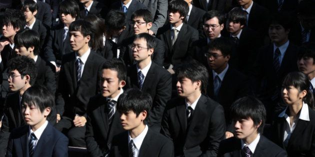 Vocational school students attend a rally to start off job-hunting in Tokyo, Japan, on Wednesday, Jan. 29, 2014. Japan's jobless rate held at 4 percent in October, and the number of positions on offer for every 100 people seeking work rose to 98, the highest level since 2007 -- a sign of tightening in the job market that could put upward pressure on wages. Photographer: Yuriko Nakao/Bloomberg via Getty Images