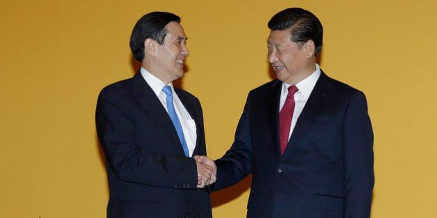 Chinese President Xi Jinping, right, and Taiwanese President Ma Ying-jeou, left, shake hands at the Shangri-la Hotel on Saturday, Nov. 7, 2015, in Singapore. The two leaders shook hands at the start of a historic meeting, marking the first top level contact between the formerly bitter Cold War foes since they split amid civil war 66 years ago. (AP Photo/Wong Maye-E)