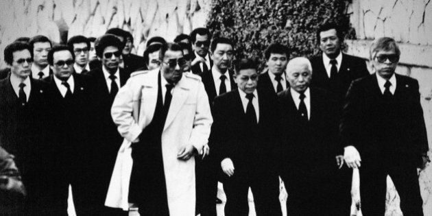 Top members of the Yamaguchi-gumi Japanâs largest Yakuza Organization, arrive for the funeral in Kobe, western Japan on Dec. 16, 1988, for their boss Masahisa Takenaka, who was killed by a splinter groupâs gunman in February 1985. Soon after Takenakaâs death the gang went to a war to avenge the murder, which has left 25 dead and 70 injured by police count, now seems to be nearing an end. (AP Photo)