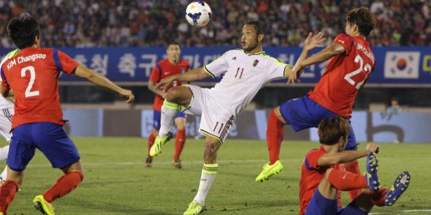 BUCHEON, SOUTH KOREA - SEPTEMBER 05: Juan Falcon of Venezuela competes for the ball with Lim Chai-Min of South Korea during the international friendly match between South Korea and Venezuela at Bucheon Stadium on September 5, 2014 in Bucheon, South Korea. (Photo by Chung Sung-Jun/Getty Images)