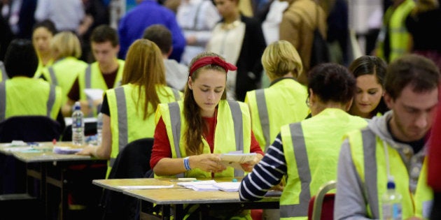 EDINBURGH, SCOTLAND - SEPTEMBER 18: Tellers count votes in the Scottish Independence Referendum at the Edinburgh count at Ingleston Hall on September 18, 2014 in Edinburgh, Scotland. Polls have now closed in the Scottish referendum and the United Kingdom await the results of this historic vote. With a substantial turnout at the polling stations the vote is too close to call and the result is expected in the early hours of Friday morning. (Photo by Jeff J Mitchell/Getty Images)