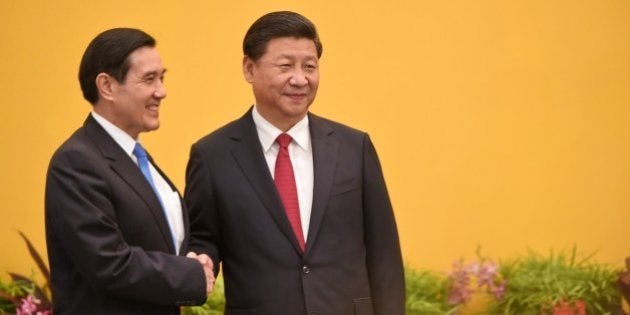 Chinese President Xi Jinping (R) shakes hands with Taiwan President Ma Ying-jeou (L) before their meeting at Shangrila hotel in Singapore on November 7, 2015. The leaders of China and Taiwan hold a historic summit that will put a once unthinkable presidential seal on warming ties between the former Cold War rivals. AFP PHOTO / Roslan RAHMAN (Photo credit should read ROSLAN RAHMAN/AFP/Getty Images)