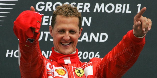 Germany's Ferrari driver Michael Schumacher celebrates during the winner's ceremony of the Formula One Grand Prix of Germany at the Hockenheimring circuit in Hockenheim, southern Germany, Sunday July 30, 2006. Schumacher won ahead of his teammate Massa and Finland's McLaren Mercedes driver Raikkonen. (AP Photo/Eckehard Schulz)