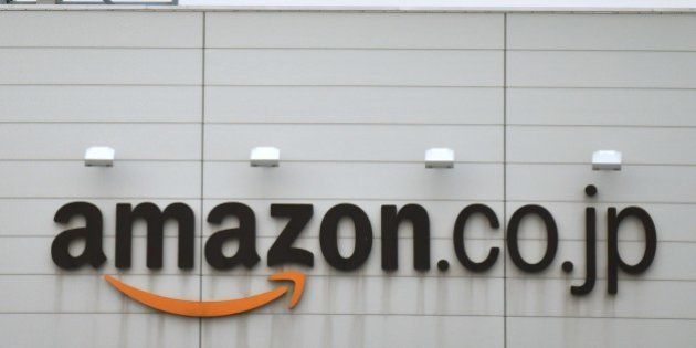This picture shows a logo of Amazon Japan displayed at the company's distribution centre in Ichikawa, Chiba prefecture on January 24, 2015. Police have raided offices of the Japanese arm of Amazon.com for allegedly letting child pornography to be posted on its website for sale, local media reported. AFP PHOTO / KAZUHIRO NOGI (Photo credit should read KAZUHIRO NOGI/AFP/Getty Images)