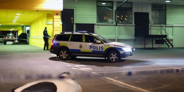A police officer examines the scene of a fatal shooting in Gothenburg, Sweden, late Wednesday, March 18, 2015. Several people were shot inside a restaurant in the city of Goteborg late Wednesday and at least two of them have died, Swedish police said. (AP Photo/ TT News Agency, Bjorn Larsson Rosvall) SWEDEN OUT
