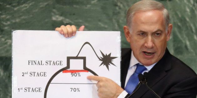 NEW YORK, NY - SEPTEMBER 27: Benjamin Netanyahu, Prime Minister of Israel, points to a red line he drew on a graphic of a bomb while addressing the United Nations General Assembly on September 27, 2012 in New York City. The 67th annual event gathers more than 100 heads of state and government for high level meetings on nuclear safety, regional conflicts, health and nutrition and environment issues. (Photo by Mario Tama/Getty Images)