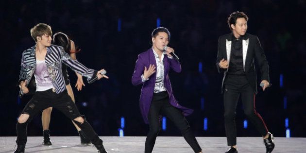INCHEON, SOUTH KOREA - SEPTEMBER 19: JYJ perform during the Opening Ceremony ahead of the 2014 Asian Games at Incheon Asiad Stadium on September 19, 2014 in Incheon, South Korea. (Photo by Chung Sung-Jun/Getty Images)