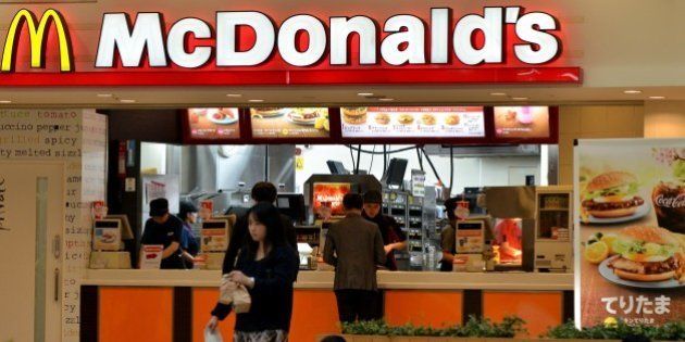 Customers buy meals at a McDonald's restaurant in Tokyo on April 16, 2015. McDonald's Holdings Japan said it expected 38 billion yen (318 million USD) in group net loss for 2015 against a backdrop of sluggish sales triggered by food-safety scandals. AFP PHOTO AFP PHOTO / Yoshikazu TSUNO (Photo credit should read YOSHIKAZU TSUNO/AFP/Getty Images)