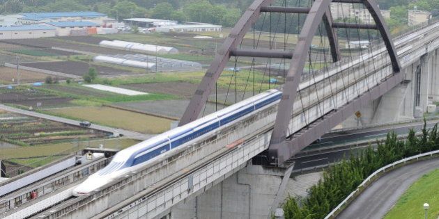 The Maglev (magnetic levitation) train carrying US Transport Secretary Ray LaHood speeds during a test run on the experimental track in Tsuru, 100km west of Tokyo, on May 11, 2010. The US transport chief took a test ride on Japan's super-fast magnetic train, a contender for President Barack Obama's multi-billion-dollar national railway project. Japan is up against China, France, Germany and other bidders as it seeks to sell its 'Shinkansen' bullet and magnetic trains for the 13-billion-USD US high-speed national rail grid. AFP PHOTO/Toru YAMANAKA (Photo credit should read TORU YAMANAKA/AFP/Getty Images)